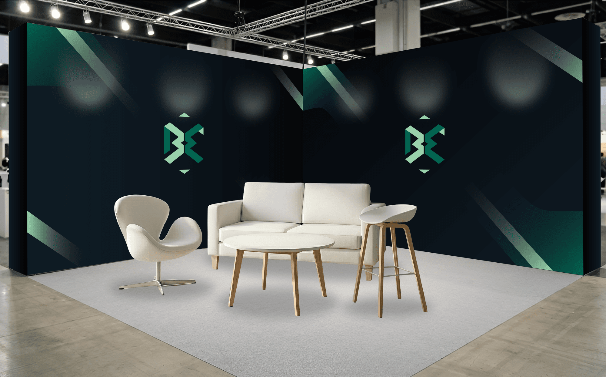 Exhibition stand with BE branding and furniture